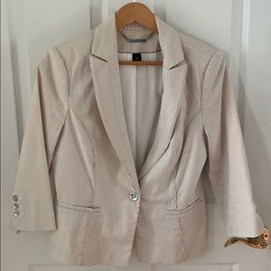 White and tan striped suit coat.